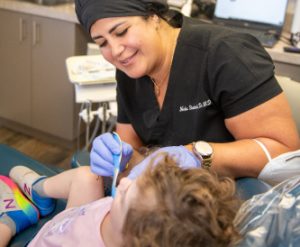 Dr. Shahrabi working on a pediatric patient